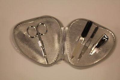 Four piece manicure set in silver heart case