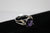 W00370 Silvertone Ring with Purple and Clear Crystals Size 10