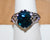 Very Pretty Silvertone High Profile filigree Ring with Faux Blue Stone Size 9